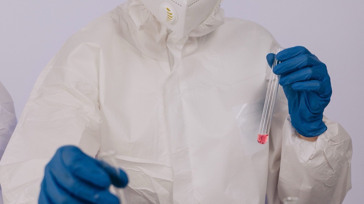 A researcher measuring samples in a laboratory