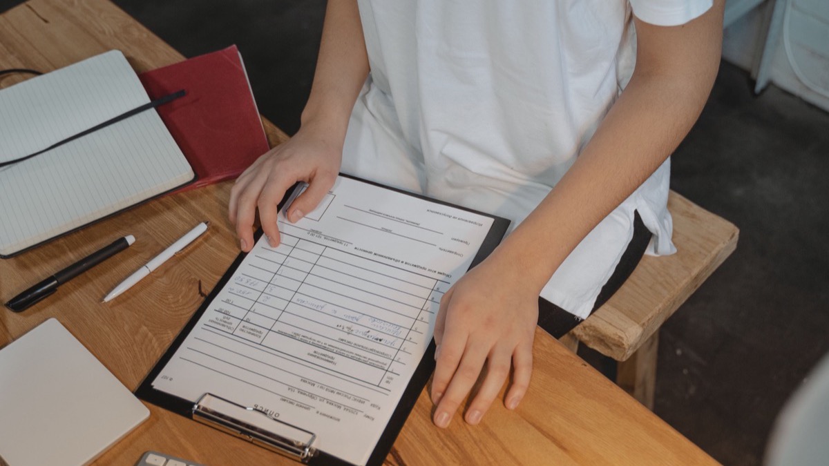 Notes and a laptop on a desk during a writing session