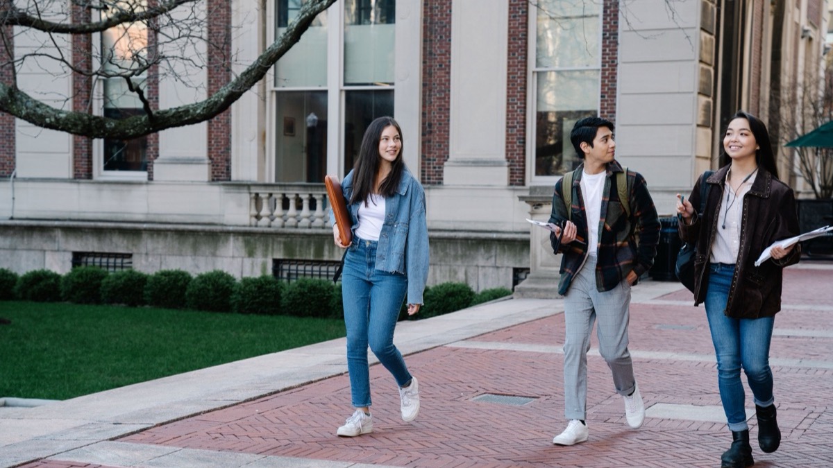 Students walking through a university campus